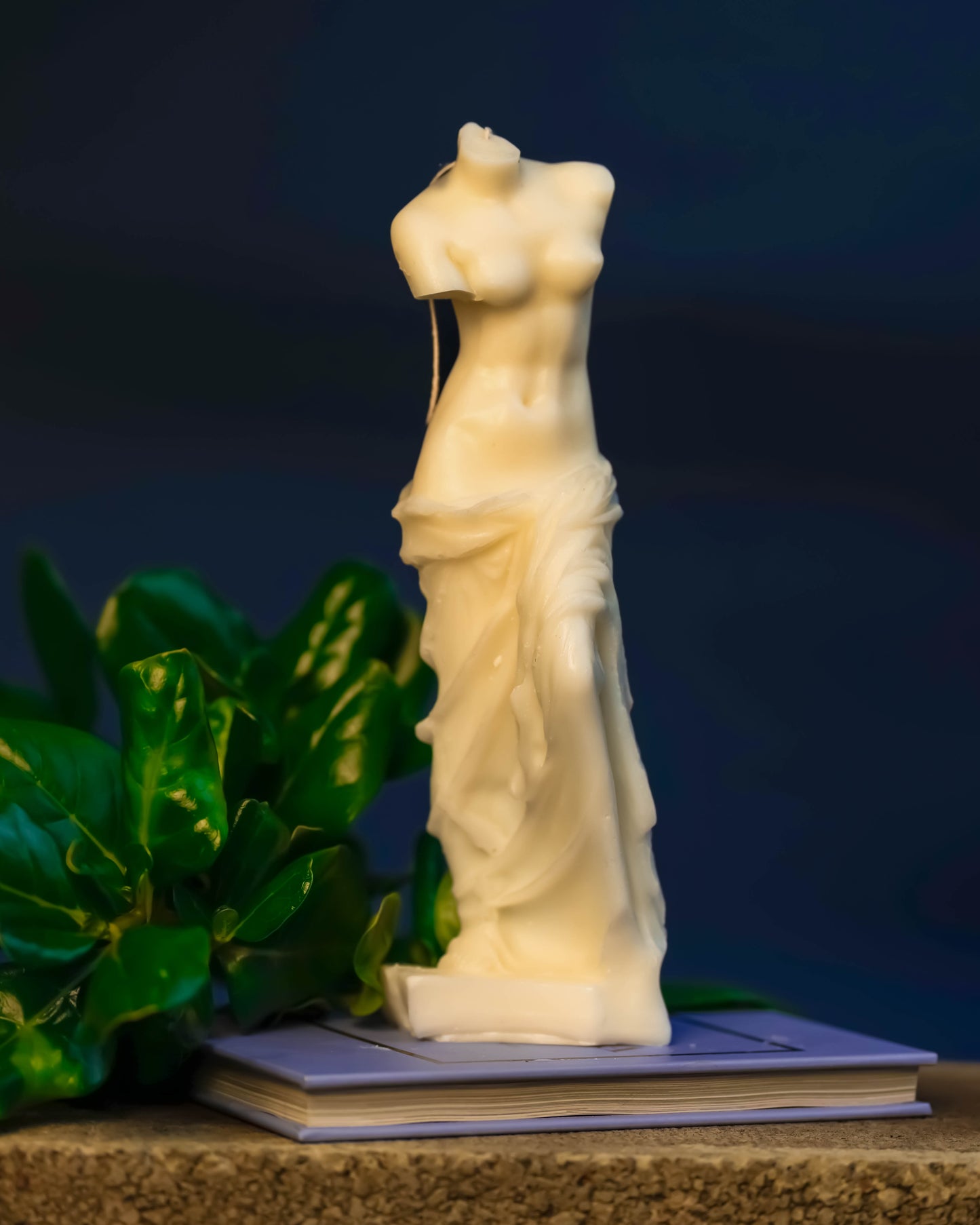 Sculpted candle embodying Aphrodite's body, radiating inspired sophistication and sensuality.